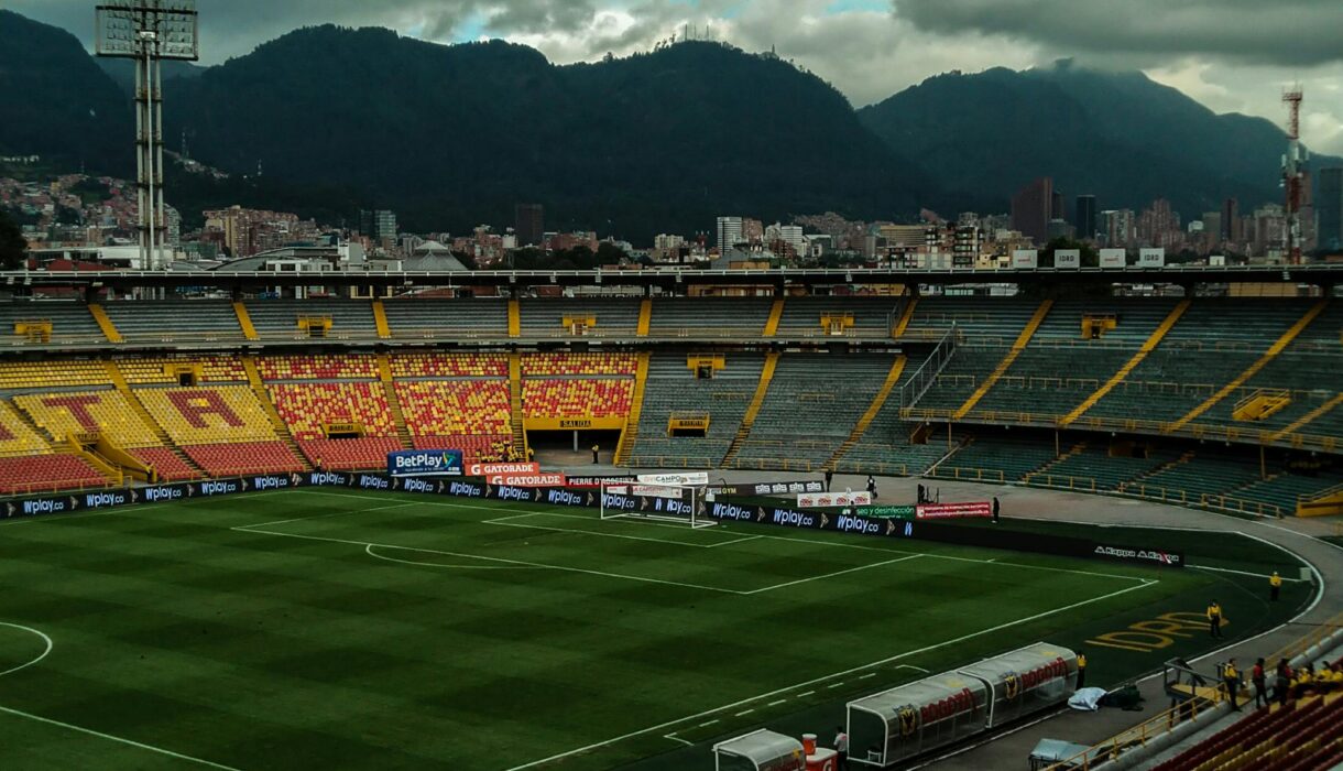 A breathtaking view of El Campin Stadium under a stormy sky in Bogota, Colombia.